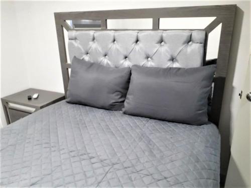 Ένα ή περισσότερα κρεβάτια σε δωμάτιο στο Santa Fé Apartamentos