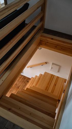 an overhead view of a room with wood flooring at Ośrodek Wypoczynkowo Sportowy Pod Żurawiem Apt. 2 in Karolewo