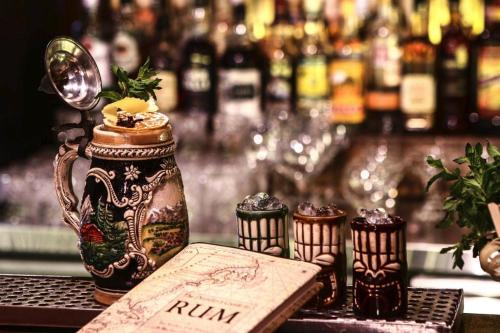 a table with a vase and a menu on a bar at Casa Di Gio in Tersephanou