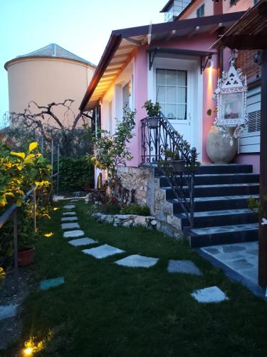 a house with a pathway leading to the front yard at Florinda Lemon's Suite in Cervo
