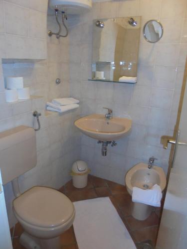 a bathroom with a toilet and a sink at Classique Cavtat Apartment in Cavtat