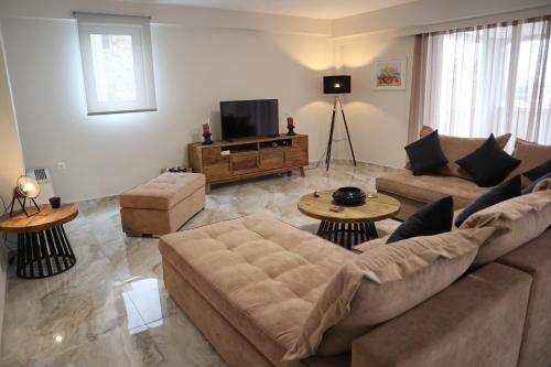 Televízia a/alebo spoločenská miestnosť v ubytovaní Catherine's Comfort Apartment No1