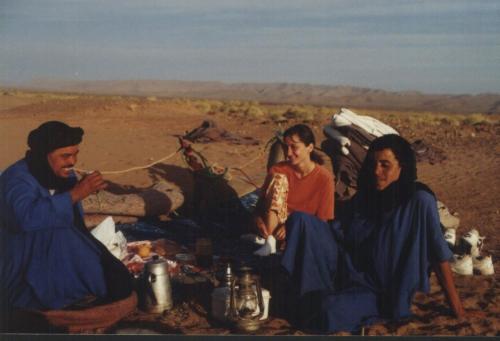 a painting of a group of people in the desert at Hôtel Le Tinsouline in Zagora