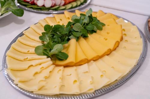 a cheese cake on a plate on a table at Pension Florián in Pavlov
