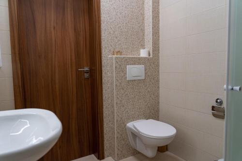 a bathroom with a toilet and a sink at Pension Florián in Pavlov