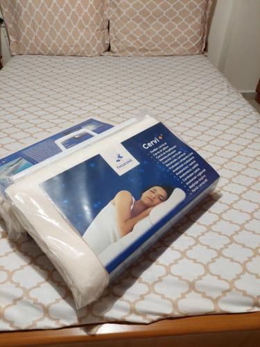 a magazine on a bed with a picture of a woman at Κλινάρι in Xanthi