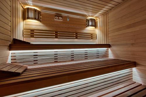 a sauna with a bench in the middle of it at Harda House Friends & Spa in Zakopane