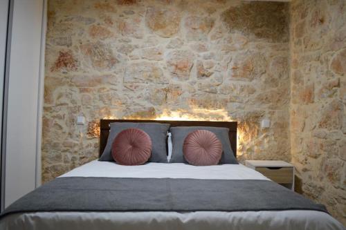 Postel nebo postele na pokoji v ubytování Casa GANCHINHO