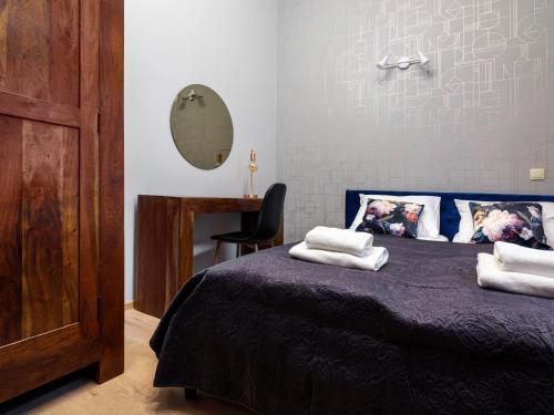 Posteľ alebo postele v izbe v ubytovaní CracWoW Market Squere Apartment