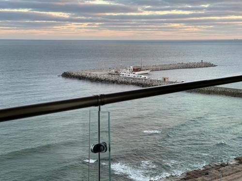 a view of a body of water with a pier at Alexander House in Alexandria