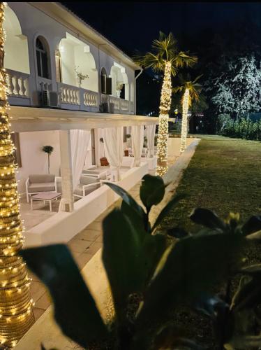 a house with christmas lights in the yard at B&B Villa D'Amato in Peschici