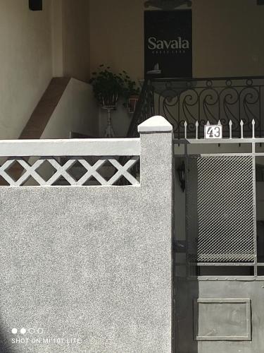 a stairway with a white railing and a building at Savala house León in León