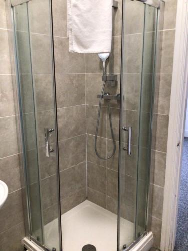 a shower in a bathroom with a glass shower stall at 96 High Street in Ryde