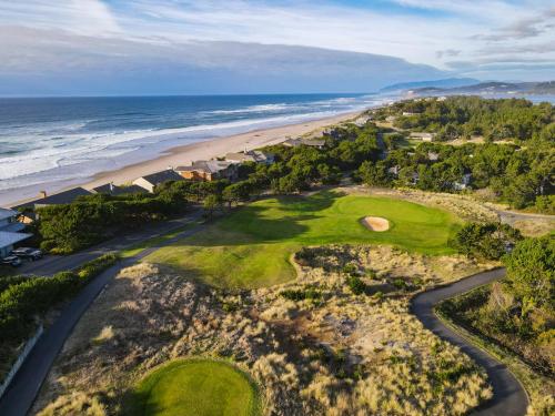an aerial view of a golf course and the ocean at Salishan Coastal Lodge in Lincoln City