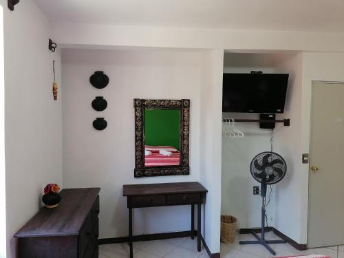 A television and/or entertainment center at Casa los Arcos Oaxaca