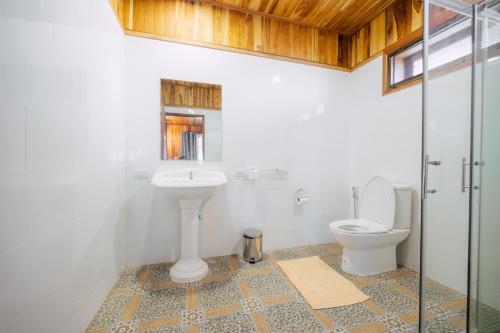 a bathroom with a sink and a toilet at Tayama Farm Khaoyai in Nakhon Ratchasima