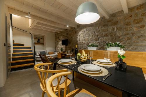 a dining room with a table and some chairs at Superior 2 Bedroom Apartment Gabriela in Dubrovnik