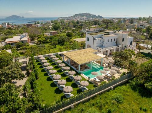vista aerea di un resort con piscina di Cala Cala Rooms,Restaurant & Farm Experience a Procida