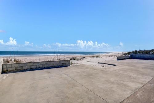 a view of the beach from a parking lot at Oceanfront Beach House in Fernandina Beach