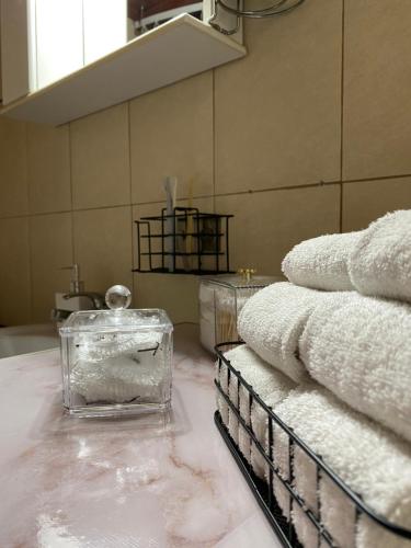 a pile of towels on a counter in a room at Villa Archontissa in Kavros