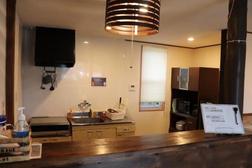 a kitchen with a sink and a counter top at コテージトガワ＜Cottage TOGAWA＞ in Fujikawaguchiko