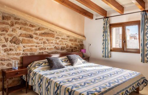 A bed or beds in a room at Casa Magui