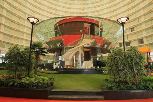 a building with a glass dome in the middle at Rajhans Belliza Luxurious Studio Apartment in Surat