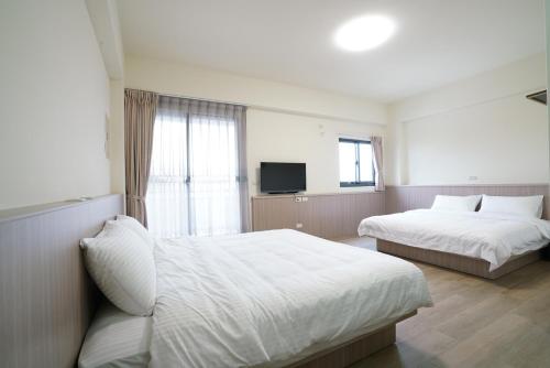 Postel nebo postele na pokoji v ubytování 享悅電梯民宿