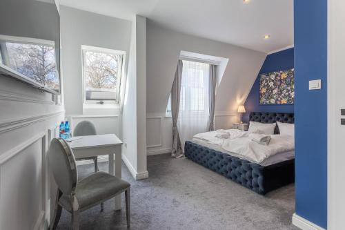 Ένα ή περισσότερα κρεβάτια σε δωμάτιο στο Monte Carlo Boutique Hotel