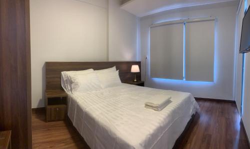 Postel nebo postele na pokoji v ubytování Charm City Apartment Di An Binh Duong
