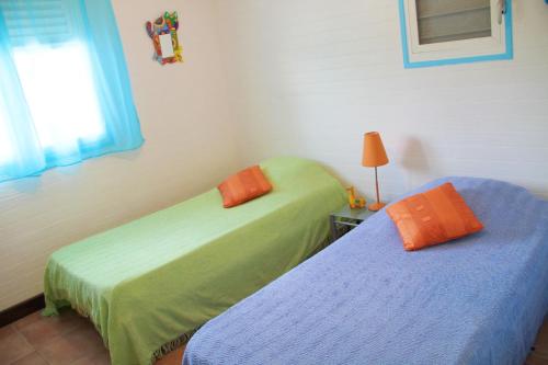 Postel nebo postele na pokoji v ubytování Villa TI JIMO