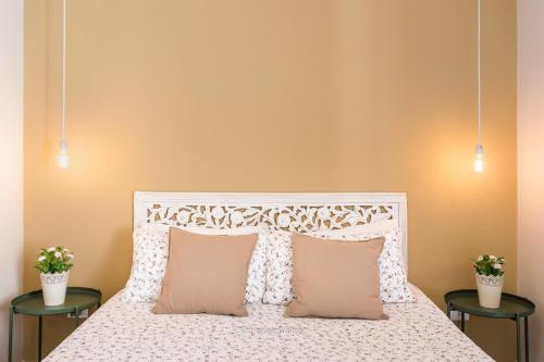 Ένα ή περισσότερα κρεβάτια σε δωμάτιο στο Il 49 Rooms Noto