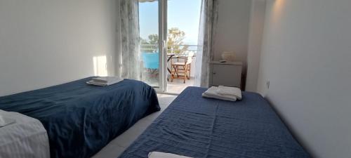 Llit o llits en una habitació de Atlas By Sea Apartment