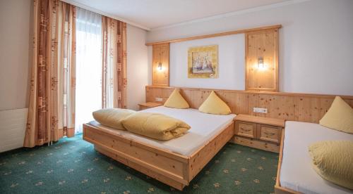 Ein Bett oder Betten in einem Zimmer der Unterkunft Kathrin Apartments - Kapplerhof