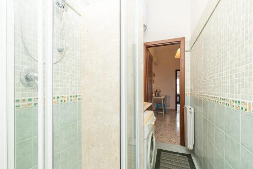 a bathroom with a shower and a walk in shower at Coastal Home in Santa Maria Navarrese