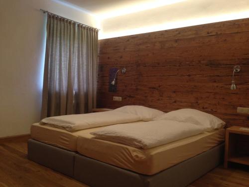 Ένα ή περισσότερα κρεβάτια σε δωμάτιο στο Appartements im Forsthaus