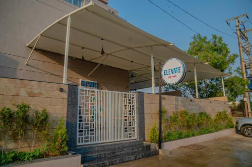 a gate in front of a building with a sign at Zip By Spree Hotels Chakan, Pune in Pune