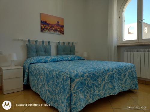 Ліжко або ліжка в номері Appartamento Torri di Avvistamento