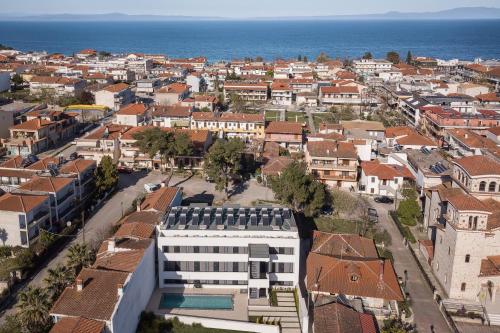 an aerial view of a city with buildings and the ocean at Calm Chaos studio 1 in Kallithea Halkidikis