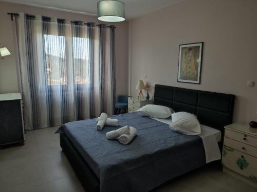 Ένα ή περισσότερα κρεβάτια σε δωμάτιο στο Villa Lakki's Ori