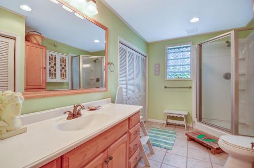 a bathroom with a sink and a shower and a toilet at DogFriendly Duplex in Fernandina Beach