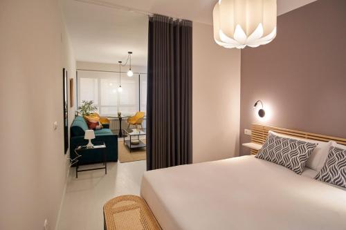 Ένα ή περισσότερα κρεβάτια σε δωμάτιο στο Apartamentos Los Arroyos
