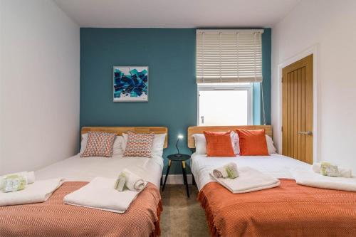 Llit o llits en una habitació de Market Street- Apartment