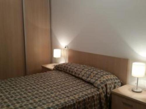 Posteľ alebo postele v izbe v ubytovaní Apartamento Finisterra