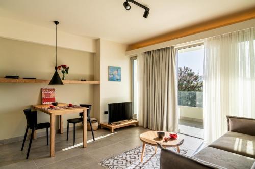 a living room with a couch and a table at SII City Luxury Suites in Rethymno