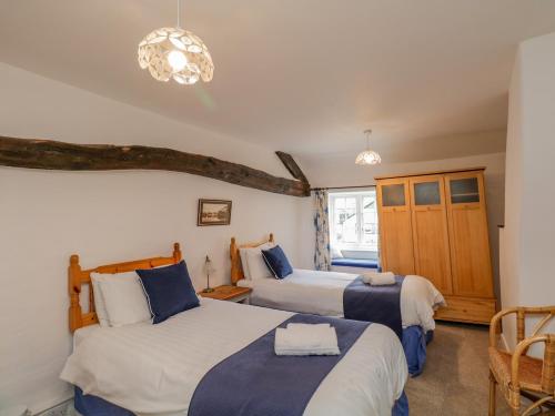 Katil atau katil-katil dalam bilik di Burnside Cottage