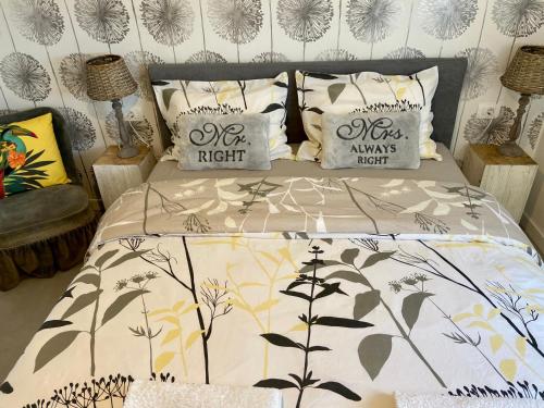 a bedroom with a bed with a comforter and pillows at New Hope Makarska in Makarska