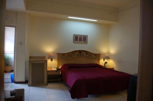 Кровать или кровати в номере Park Palace Hotel