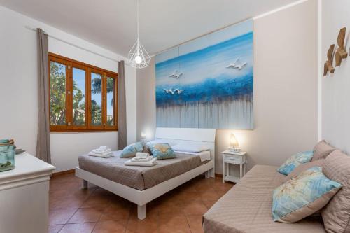 Ένα ή περισσότερα κρεβάτια σε δωμάτιο στο Residence I Tesori di San Vito