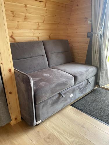 a couch in the corner of a room at Wall park touring Centry road camping in Brixham